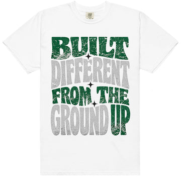 White HeatLit ‘Built Different From The Ground Up’ tee with a Pine Green front graphic — forest green and grey elephant-print texture.