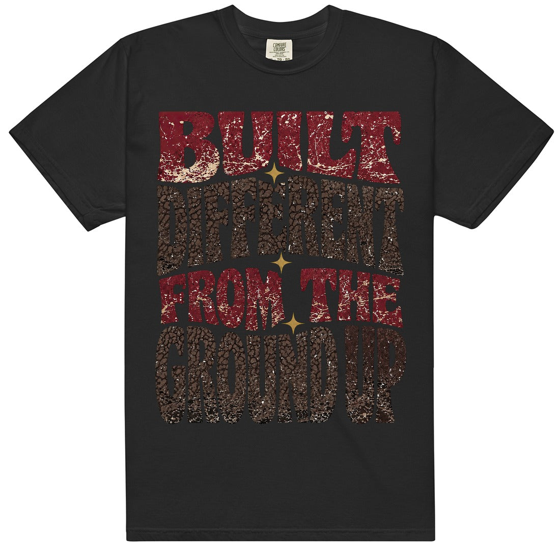 White HeatLit ‘Built Different From The Ground Up’ tee with a Bin 23 front graphic — cardinal-red type, chocolate-brown elephant print and gold star sparks on a cream speckle.